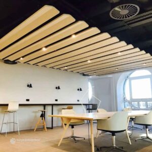 Modern baffle ceiling system with suspended metal panels for enhanced aesthetics and acoustics.