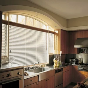 Stylish aluminium venetian blinds installed in kitchen at a home in Kerala