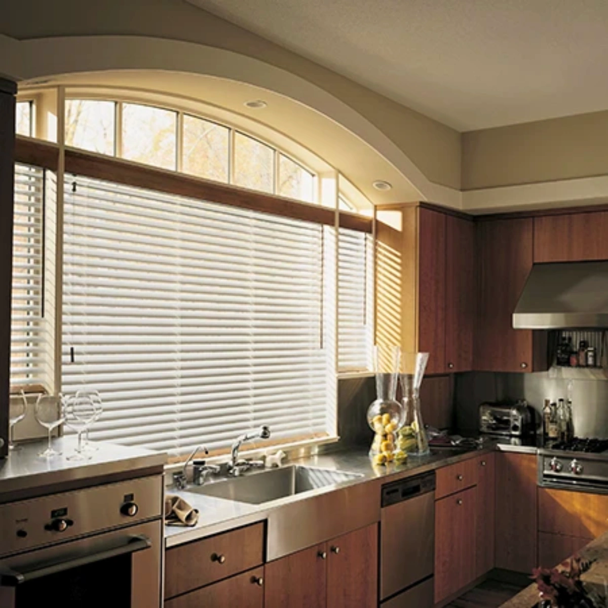 Stylish aluminium venetian blinds installed in kitchen at a home in Kerala