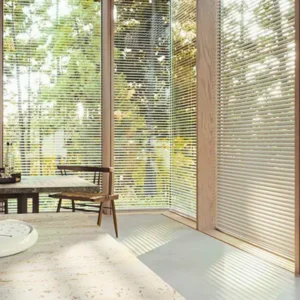 Stylish PVC venetian blinds installed in balcony with glass sliding panel on window in Kerala