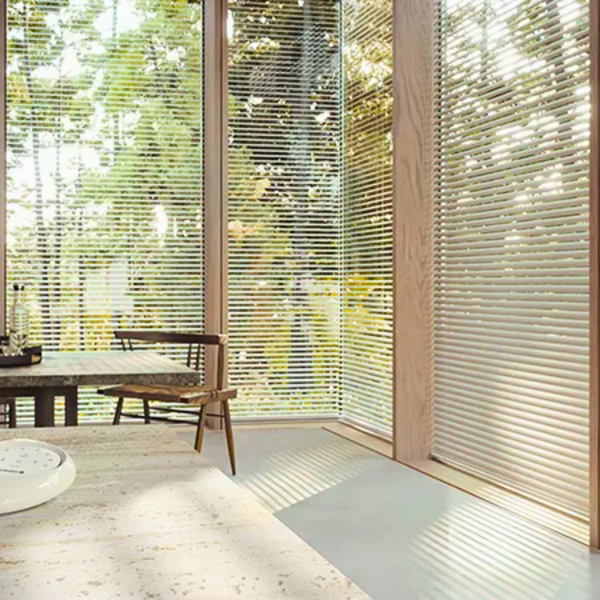 Stylish PVC venetian blinds installed in balcony with glass sliding panel on window in Kerala