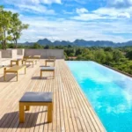 Learn how to choose moisture-resistant and anti-skid deck flooring for resort pool areas in Kerala’s monsoon climate.