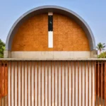 Weather-resistant facade system on hotel building in Kerala during monsoon